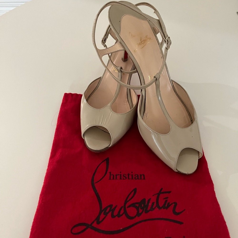 Christian Louboutin T-Strap peep toe.